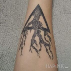 Tattoo #1 treeo on the forearm motif: black and gray style: graphic / illustrative