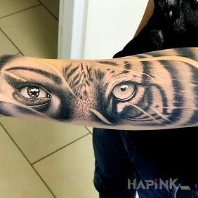 Tattoo Tiger on the forearm motif: faces style: realistic