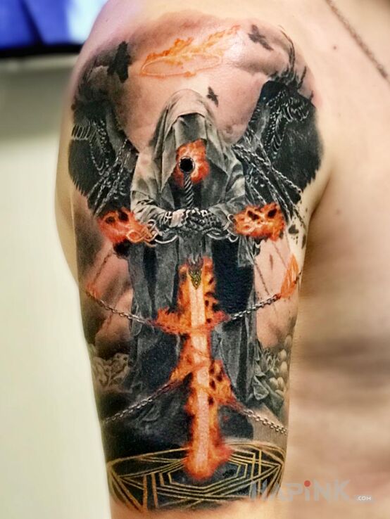 Tattoo Anioł śmierci in demons motif and realistic style on the upper arm