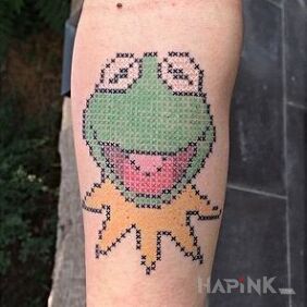 Tattoo Kermit on the forearm motif: characters