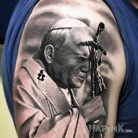 Tattoo Pope John Paul on the upper arm motif: faces style: realistic