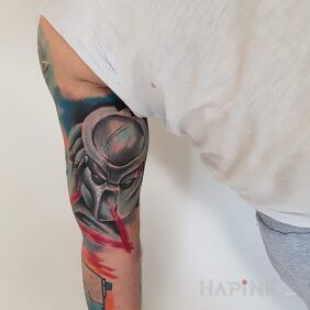 Tattoo Predator, one of the unforgettable films and characters. on the upper arm motif: faces style: graphic / illustrative