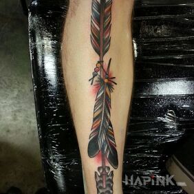 Tattoo Arrow on the tibia on the calf motif: colorful style: oldschool