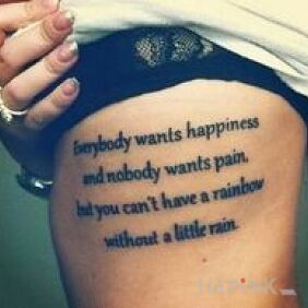 Tattoo Tex on happiness on the ribs motif: lettering style: calligraphy