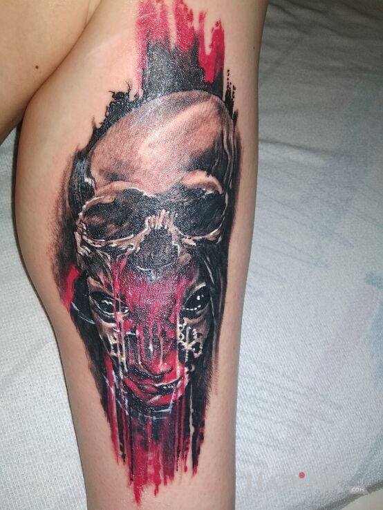 Tattoo Mayhem in dark motif and trash polka style on the calf