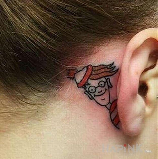 Tattoo Wally in characters motif and graphic / illustrative style behind the ear