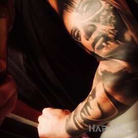 Tattoo Sleeve on the forearm motif: skulls style: realistic
