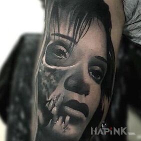 Tattoo Arm on the upper arm motif: faces style: realistic