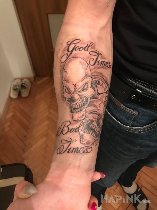 Tattoo Pierwszy tattoo in faces motif and calligraphy style on the forearm