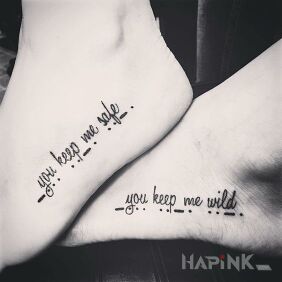 Tattoo Security and wildness on the foot motif: lettering style: calligraphy
