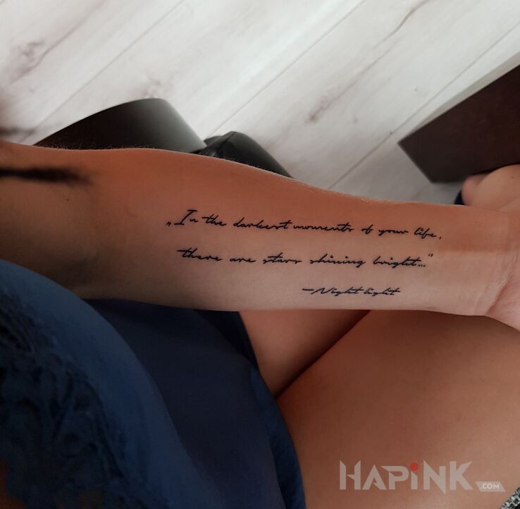 Tattoo Napisy in lettering motif and calligraphy style on the forearm