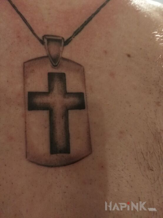 Tattoo Nieśmiertelnik in black and gray motif and graphic / illustrative style on the chest