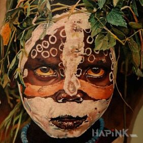 Tattoo African child on the leg motif: faces