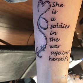 Tattoo The war against yourself on the forearm motif: lettering style: calligraphy