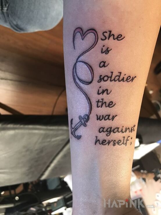 Tattoo Wojna z samym sobą in lettering motif and calligraphy style on the forearm