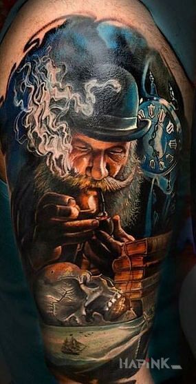 Tattoo Dziadzia in objects motif and realistic style on the upper arm