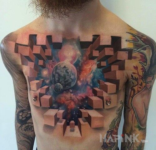 Tattoo Absolutna miazga! in cosmos motif on the chest