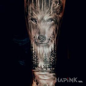 Tattoo Wolf on the forearm motif: black and gray style: realistic