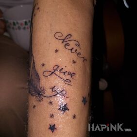 Tattoo Never give up on the forearm motif: lettering style: calligraphy