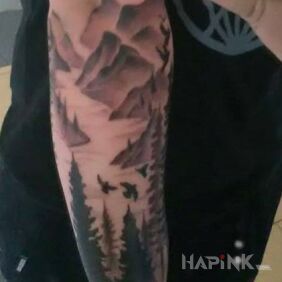 Tattoo Forest of the mountains On the arm motif: black and gray style: realistic