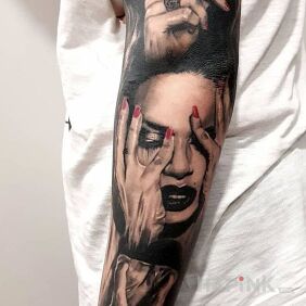 Tattoo Silence on the upper arm motif: black and gray style: realistic