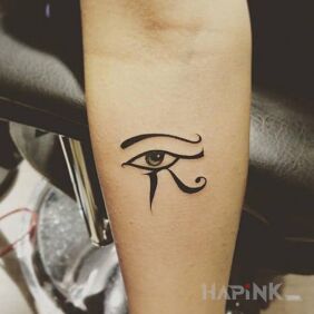 Tattoo Eye of Horus on the forearm motif: black and gray style: graphic / illustrative