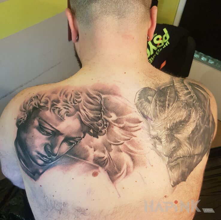 Tattoo Anioł i szatan in demons motif and realistic style on the shoulder blades