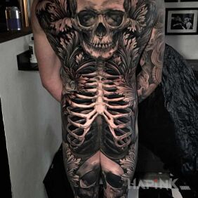 Tattoo Great Skeleton on the back motif: black and gray style: realistic