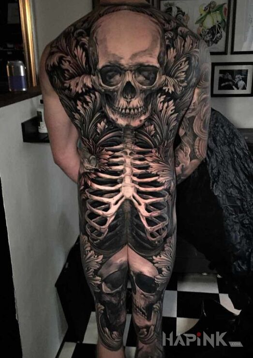 Tattoo Great Skeleton in flowers motif and realistic style on the back