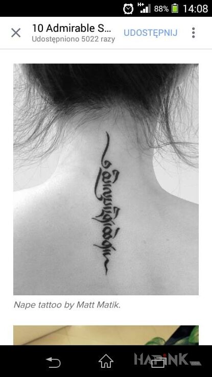 Tattoo Tajemniczy napis in lettering motif on the nape