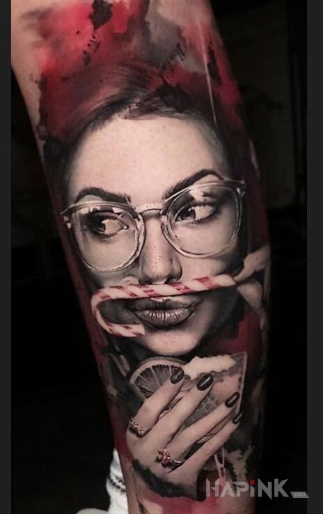 Tattoo Laska z laską in faces motif and realistic style on the calf