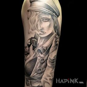 Tattoo A woman with character on the upper arm motif: characters style: realistic