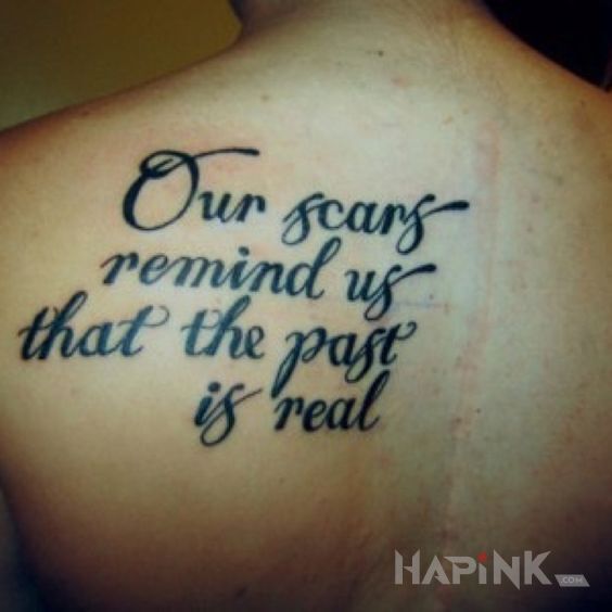 Tattoo Przeszlosc in lettering motif and calligraphy style on the shoulder blades