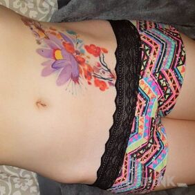 Tattoo Floral on the stomach motif: flowers style: Watercolor