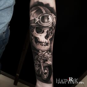 Tattoo Motorcyclist on the forearm motif: black and gray style: realistic
