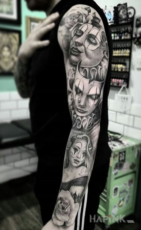 Tattoo Klauny in black and gray motif and chicano style on the upper arm