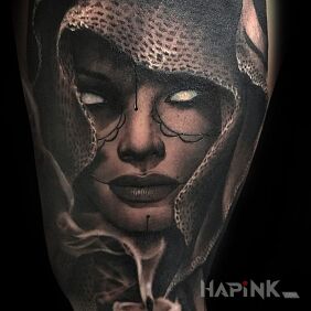 Tattoo No eyes on the upper arm motif: black and gray style: realistic
