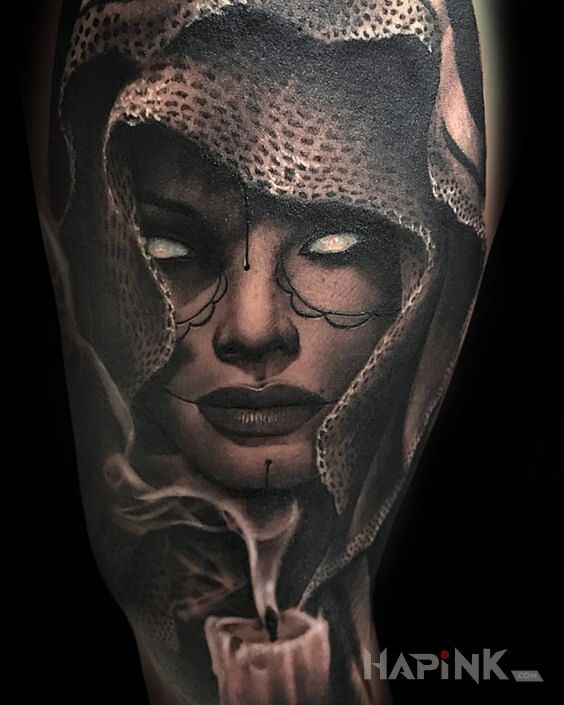 Tattoo Brak oczu in faces motif and realistic style on the upper arm