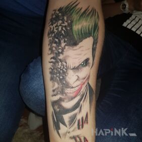 Tattoo Joker on the forearm motif: colorful style: realistic