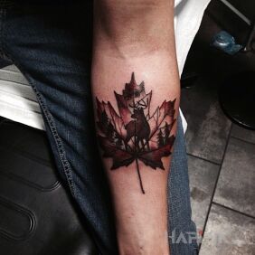 Tattoo Maple leaf on the forearm motif: animals