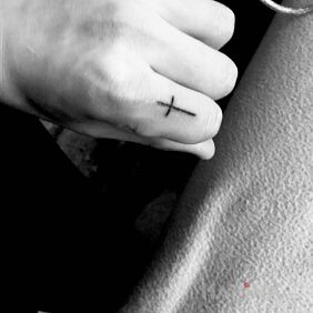Tattoo Cross on the fingers motif: religious style: minimalistic