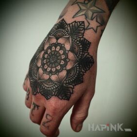 Tattoo Flower on the hand motif: flowers