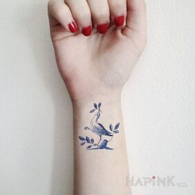 Tattoo Bird on a galoshes on the wrist motif: animals style: graphic / illustrative
