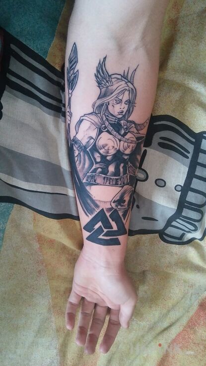 Tattoo Valkyrie in characters motif and graphic / illustrative style on the forearm