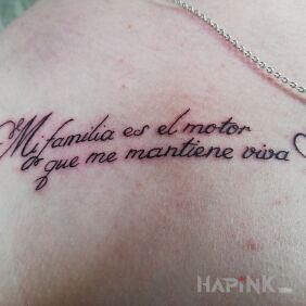 Tattoo Women's on the collarbone motif: lettering style: calligraphy