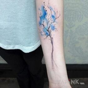 Tattoo Tree on the forearm motif: flowers