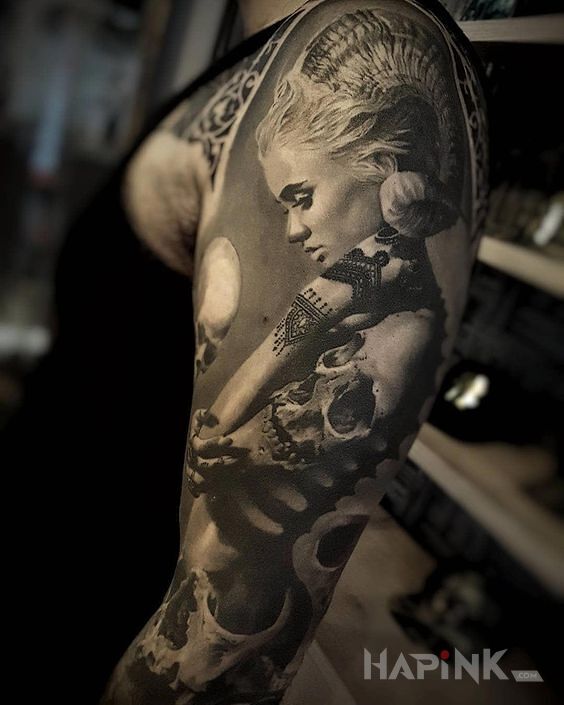 Tattoo Rogate dziewczę in demons motif and realistic style on the upper arm