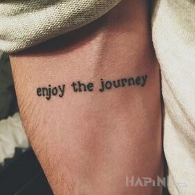 Tattoo Travel on the forearm motif: lettering style: calligraphy