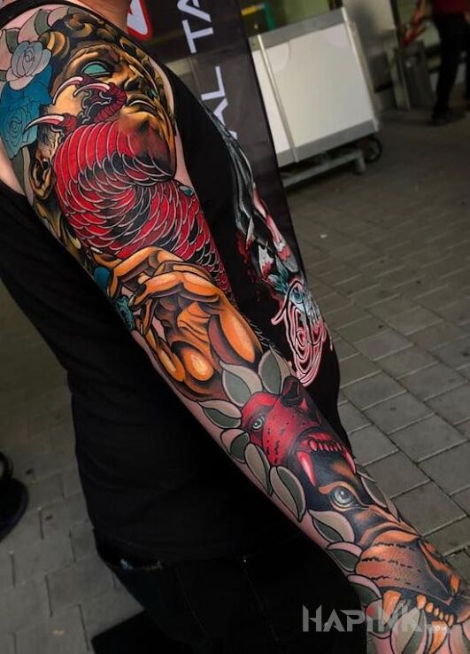 Tattoo Kolorowanka in faces motif and neo-traditional style on the forearm