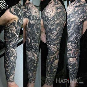 Tattoo Devils on the upper arm motif: black and gray style: realistic